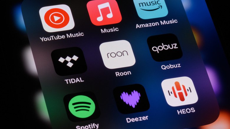 Several music streaming apps arranged in an iPhone home screen folder