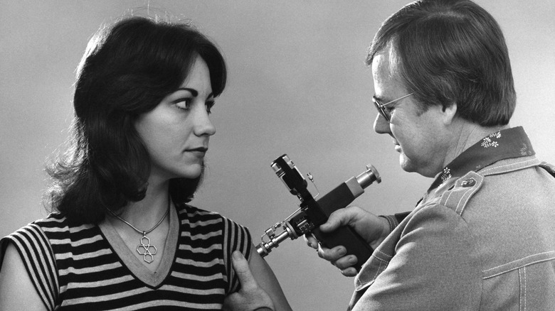 Historic photo of jet injector in use