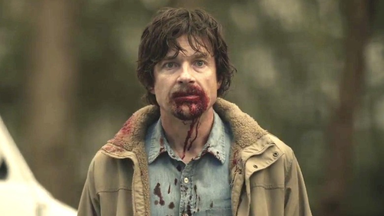 Jason Bateman as Terry Maitland with blood on his face in The Outsider