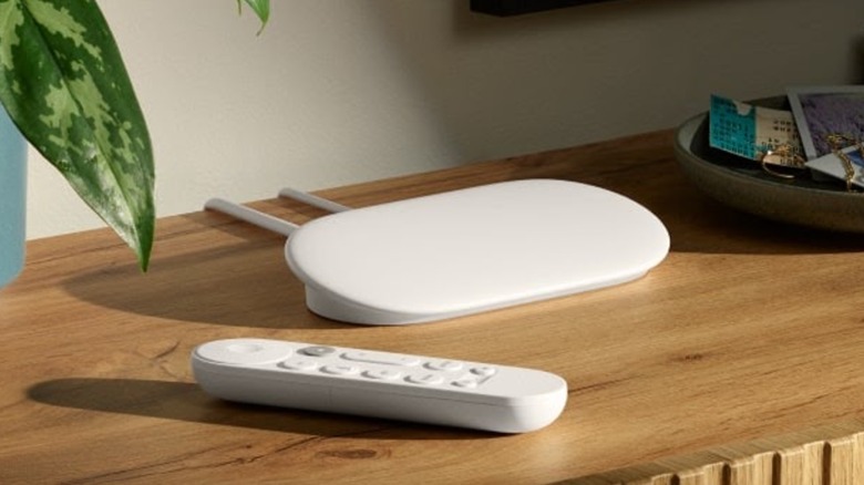 Google TV Streamer 4K and remote on wooden TV tabletop