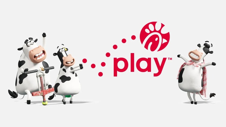 Three computer generated anthropomorphic cows stand around the Chick-fil-A Play logo, one is wearing a blanket like a cape and another bounces on a pogo stick