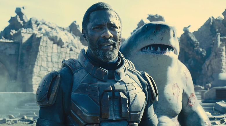 Bloodsport and King Shark standing next to each other