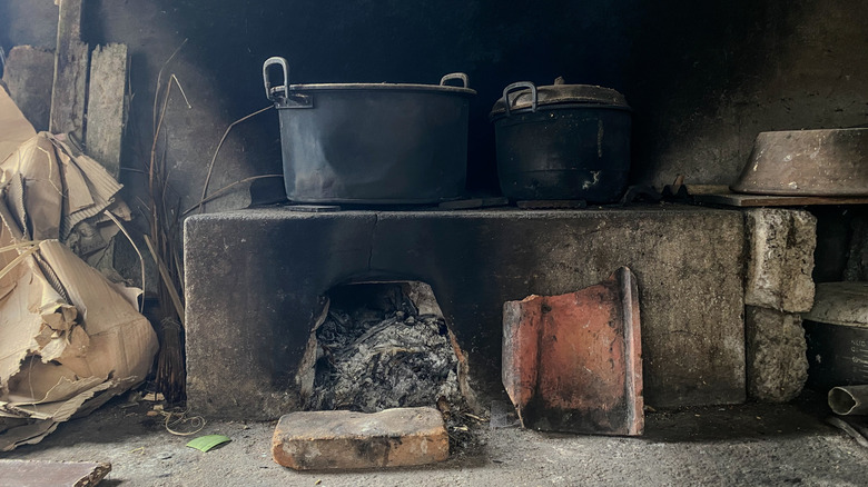 A wood-burning stove in a rural kitchen.
