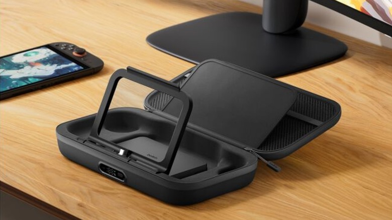 Belkin Charging Case Pro on wooden table with kick stand extended next to Switch 2