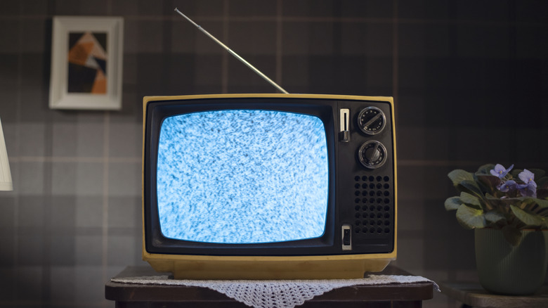 Vintage tube television showing static on the screen
