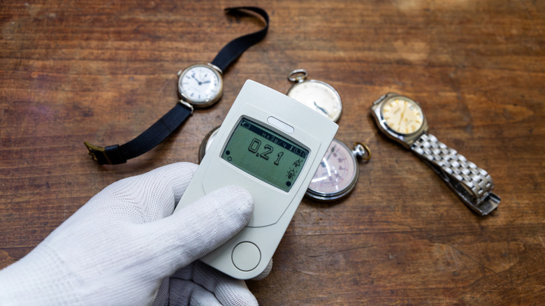 A environmental testing device scanning a number of vintage watches