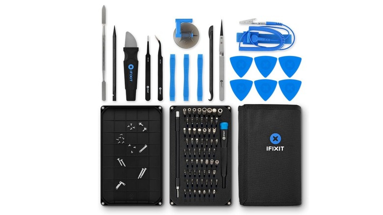 iFixit Pro Tech Toolkit with precision screwdrivers, bits, spudgers, tweezers, opening picks, and repair accessories.