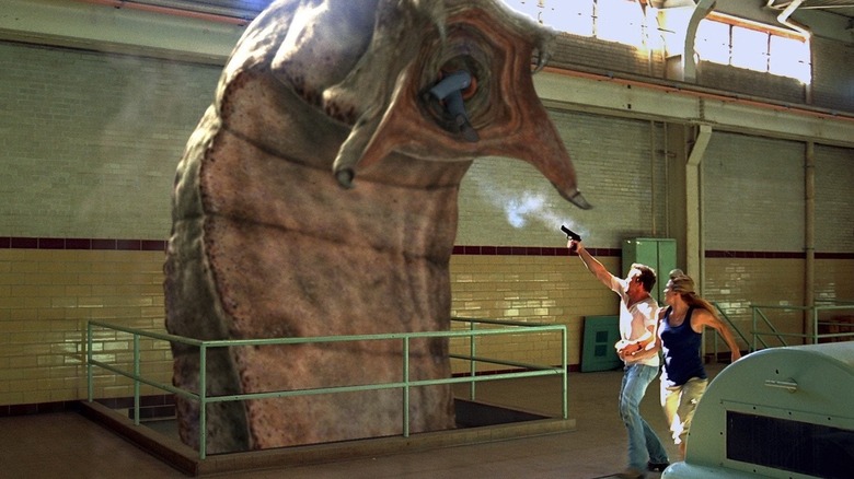 Daniel and Alicia shooting at the Mongolian Death Worm in "Mongolian Death Worm."