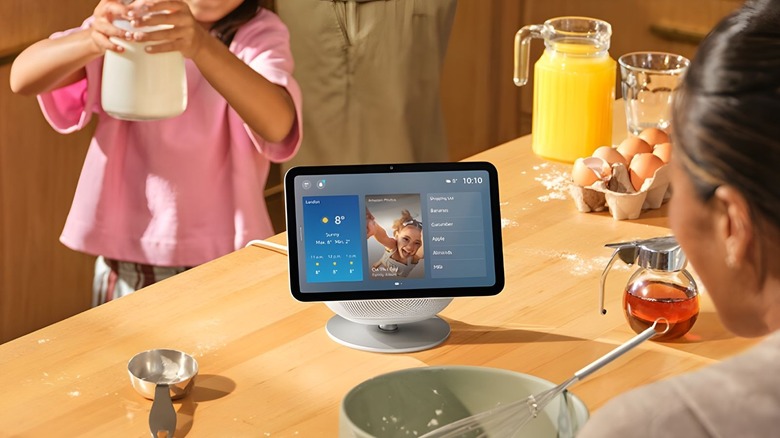 Echo Show on a kitchen worktop whilst a family bakes.