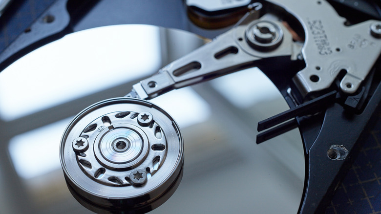 Zoomed-in view of a hard disk drive (HDD) showing the read and write head