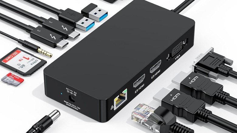 Docking station with a ton of cables being plugged in showing full connectivity.