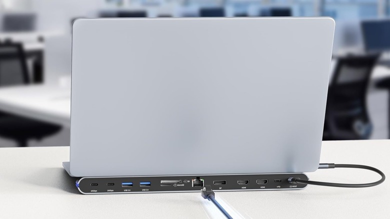Acer docking station 8-in-1 that doubles as a stand for laptops visible from behind.