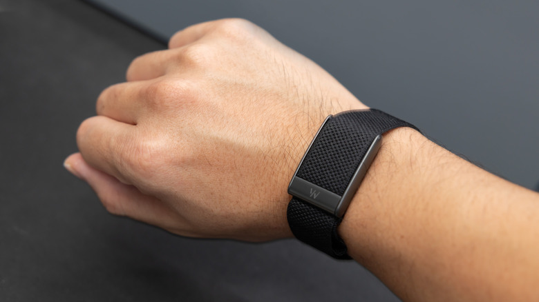A Whoop band on a wrist.