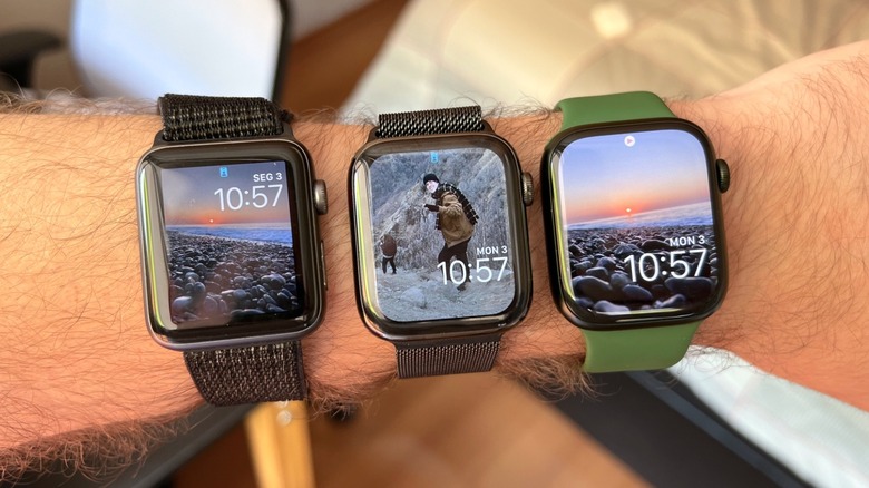 Close-up shot of three Apple Watch models on a man's arm