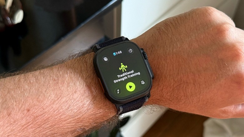 A close-up shot of a man wearing an Apple Watch