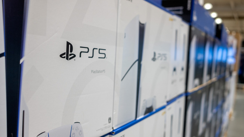 PlayStation 5 consoles on a shelf in a store