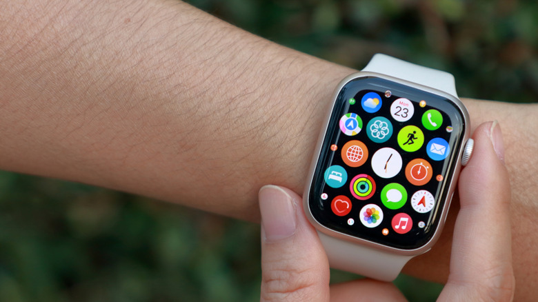 Clicking the Digital Crown on an Apple Watch.