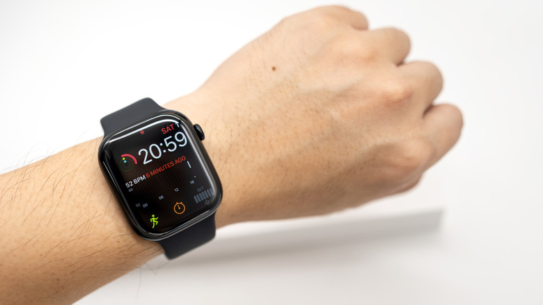 The Apple Watch Series 11 on hand.