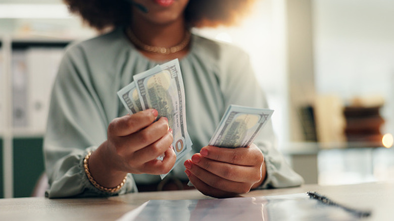 Person counting cash
