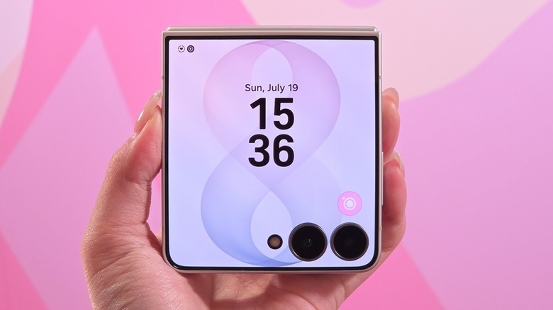 Person holding a foldable Samsung Galaxy Z Flip 8 phone