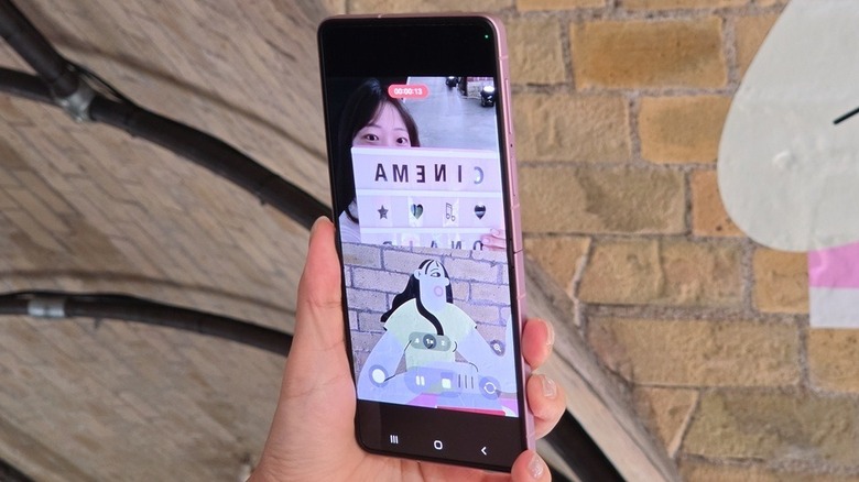 Person using dual recording on the Samsung Galaxy Z Flip 8 phone