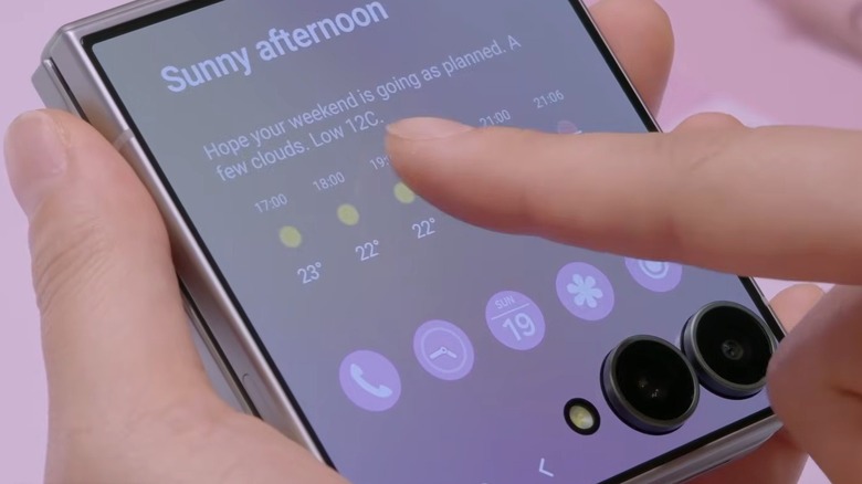 Person using cover display on Samsung Galaxy Z Flip 8 phone