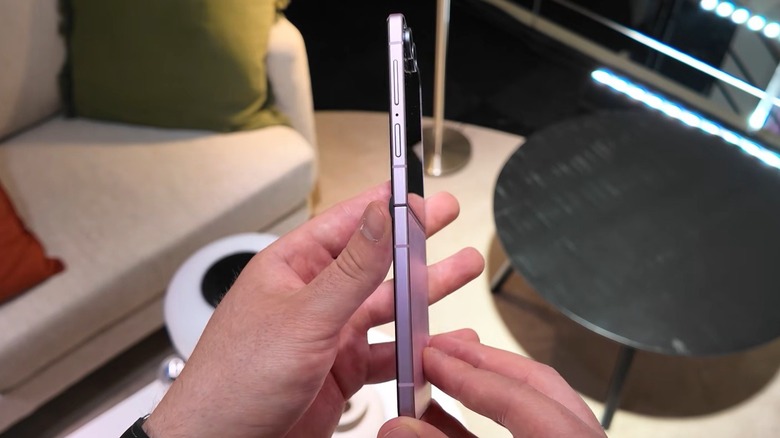 Person inspecting the thin design of the Samsung Galaxy Z Flip 8 phone