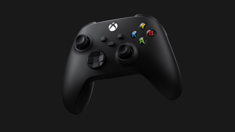 A black Xbox controller on a black background