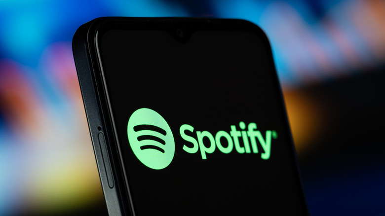 The Spotify logo on a smartphone.