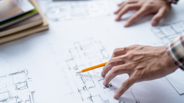 Drawing of house plans evaluating needs