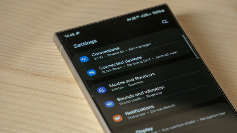 settings menu on samsung s24 ultra placed on a wooden table
