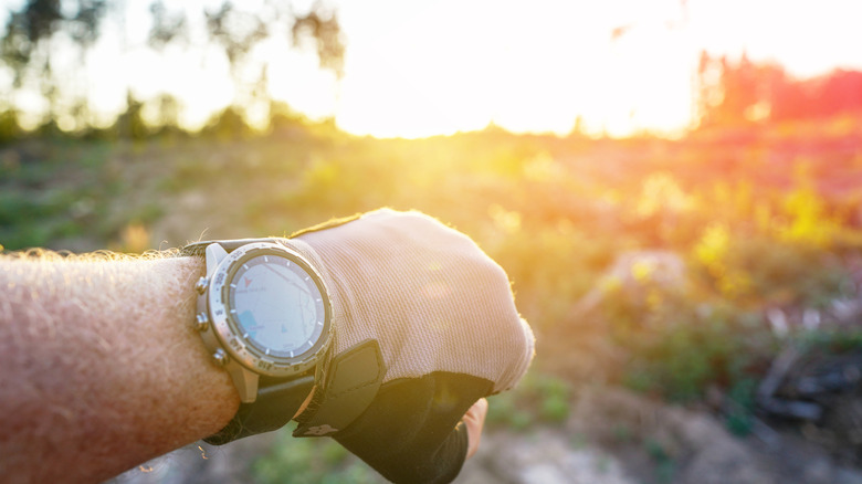 A person looking at Google Maps on their smartwatch while outdoors