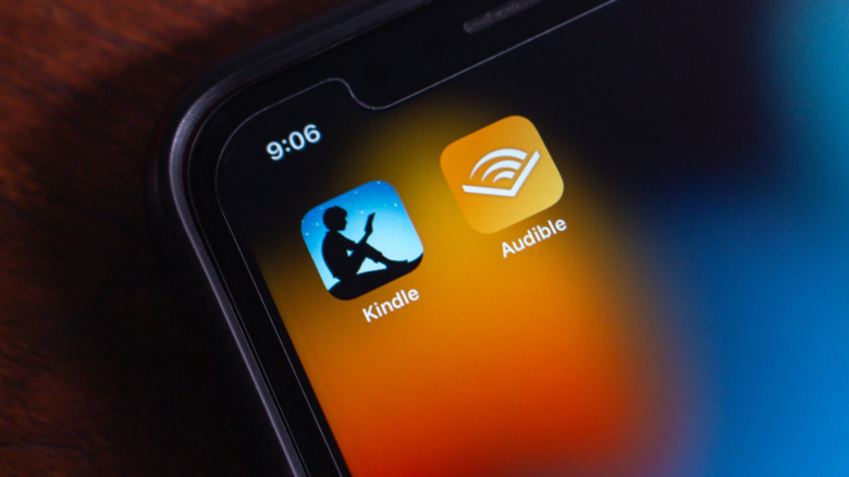 Audible and Kindle app icons on phone screen