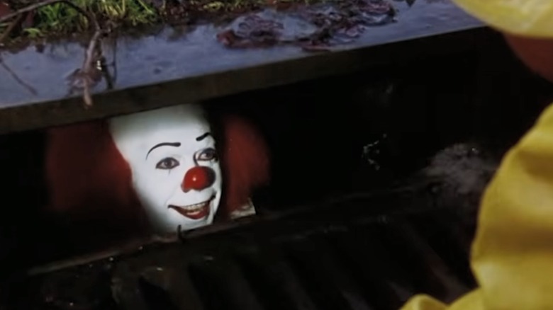 Pennywise the Clown in a storm drain in the IT miniseries