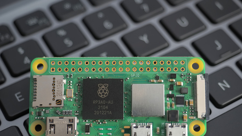 Close-up of a Raspberry Pi Zero on a laptop keyboard