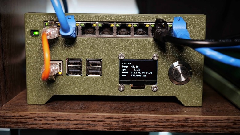 A Raspberry Pi Wi-Fi router with cables plugged into several ports
