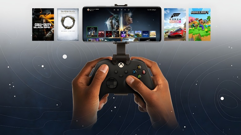 A marketing image of an Xbox controller held by a person navigating the Xbox dashboard on a smartphone on a Starfield menu-themed background.