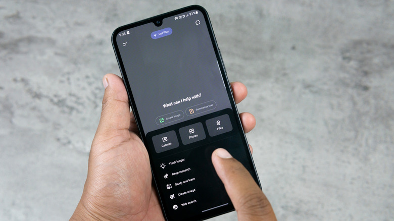 fingers scrolling through the options on the chatgpt mobile app