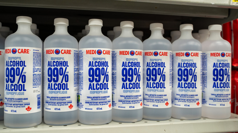 Bottles of isopropyl alcohol on a store shelf.