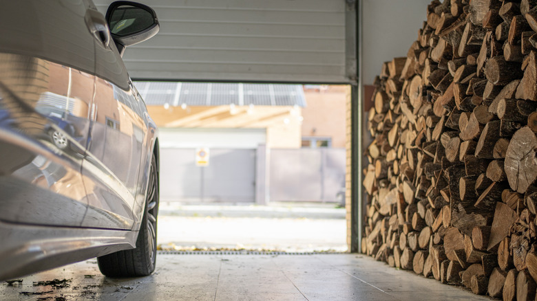 A car in a garage in the winter.