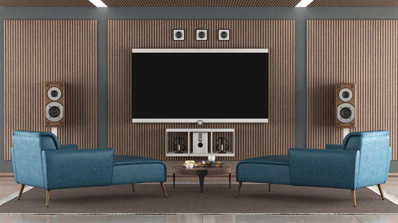 Home theater speakers placed around a large TV.