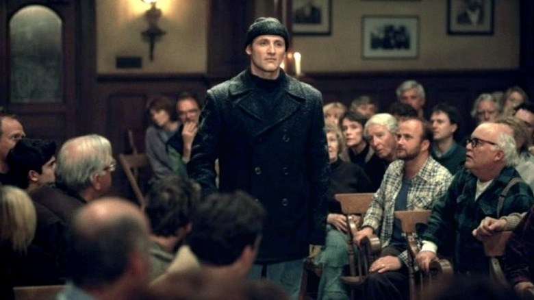 Andre Linoge standing among a group of people in "Storm of the Century."