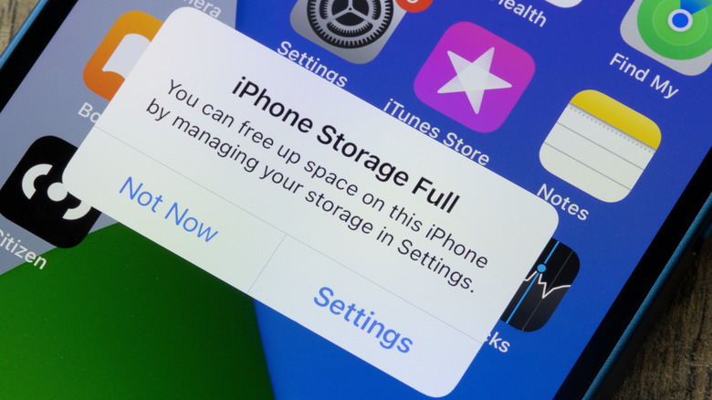 An iPhone with a pop-up stating that the storage is full