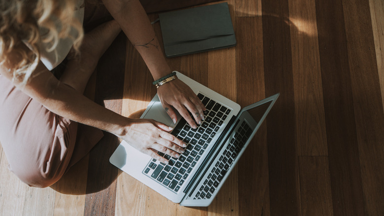 A woman using a MacBook