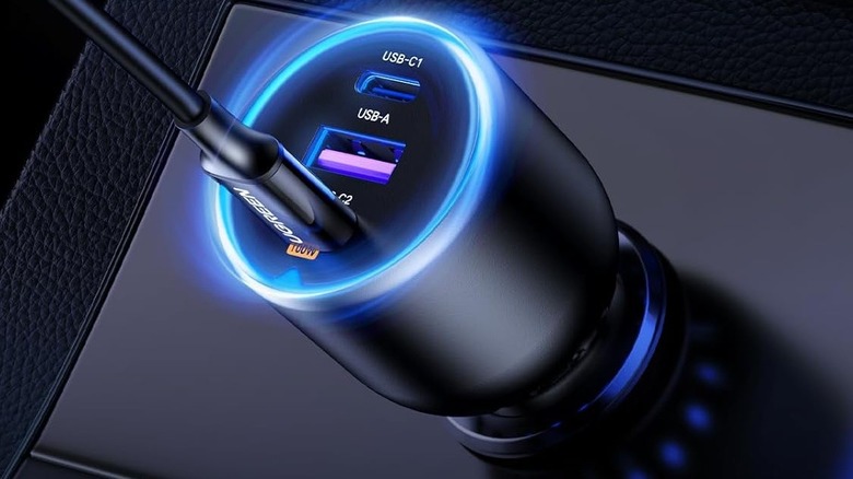 UGREEN 130W USB-C Car Charger mounted in a car with a lit blue LED light