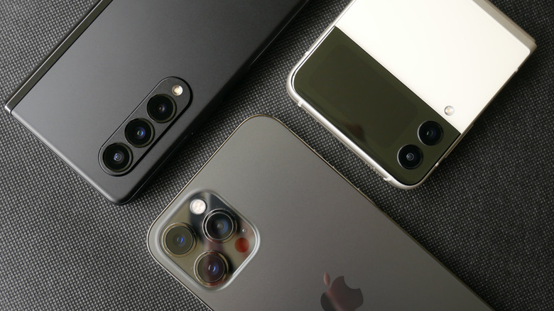 samsung galaxy fold 3 and flip 3 placed next to an iPhone 12