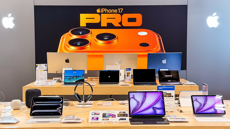 apple products and other tech gadgets on display in a store with an iPhone 17 Pro banner in the background