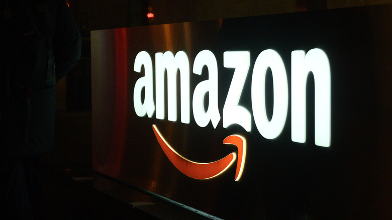 An Amazon sign at night.