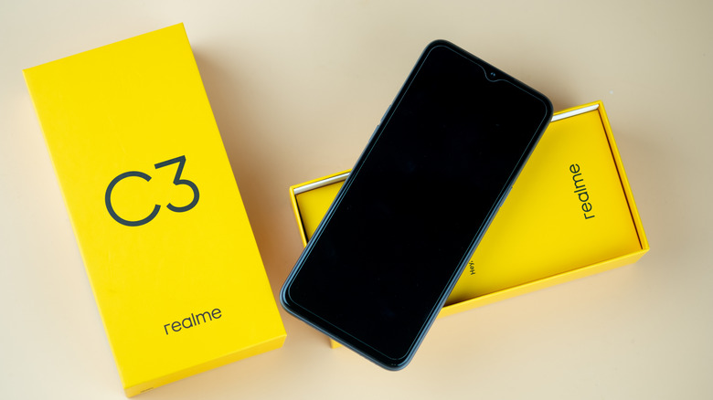 Realme C3 smartphone with its packaging box