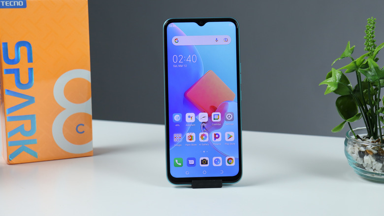 Tecno Spark 8C smartphone with its packaging box